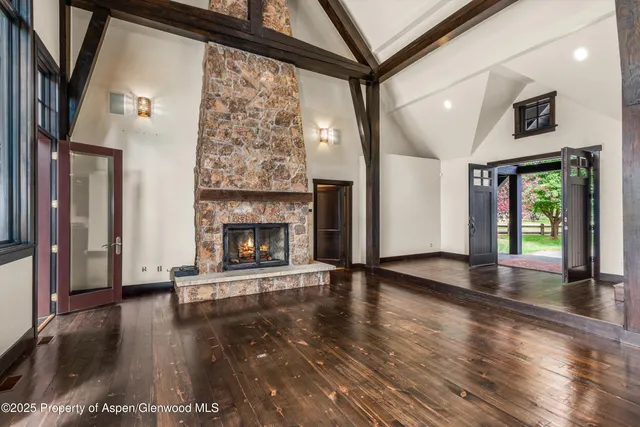 a view of a living room and a balcony
