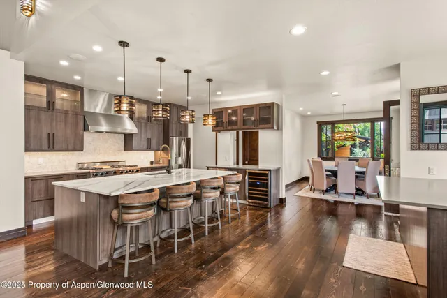 a bedroom with a large bed and a potted plant
