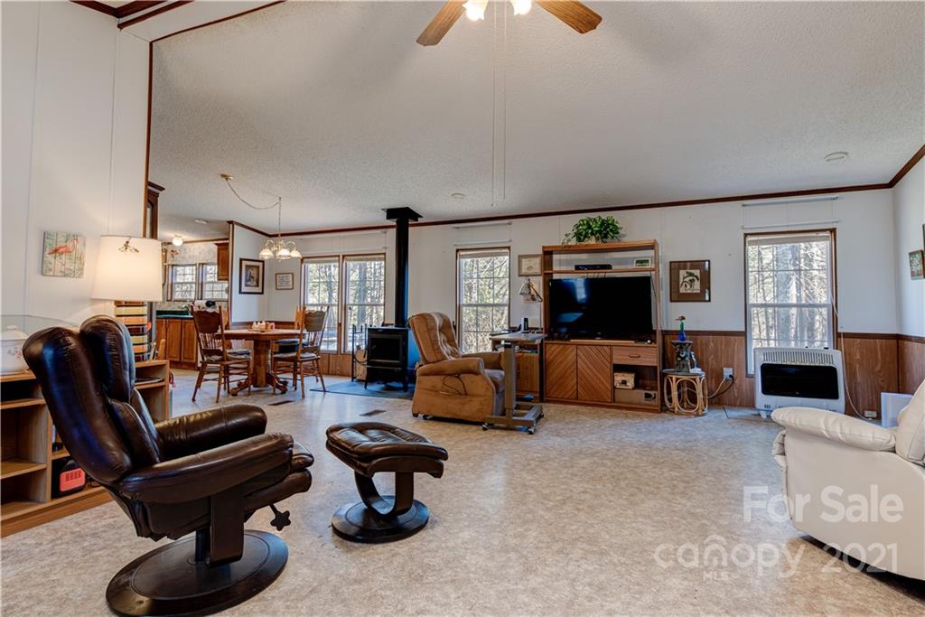 184 Terrys Gap Loop Road Fletcher, NC 28732 - Photo 3 of 28 a living room with furniture and a flat screen tv