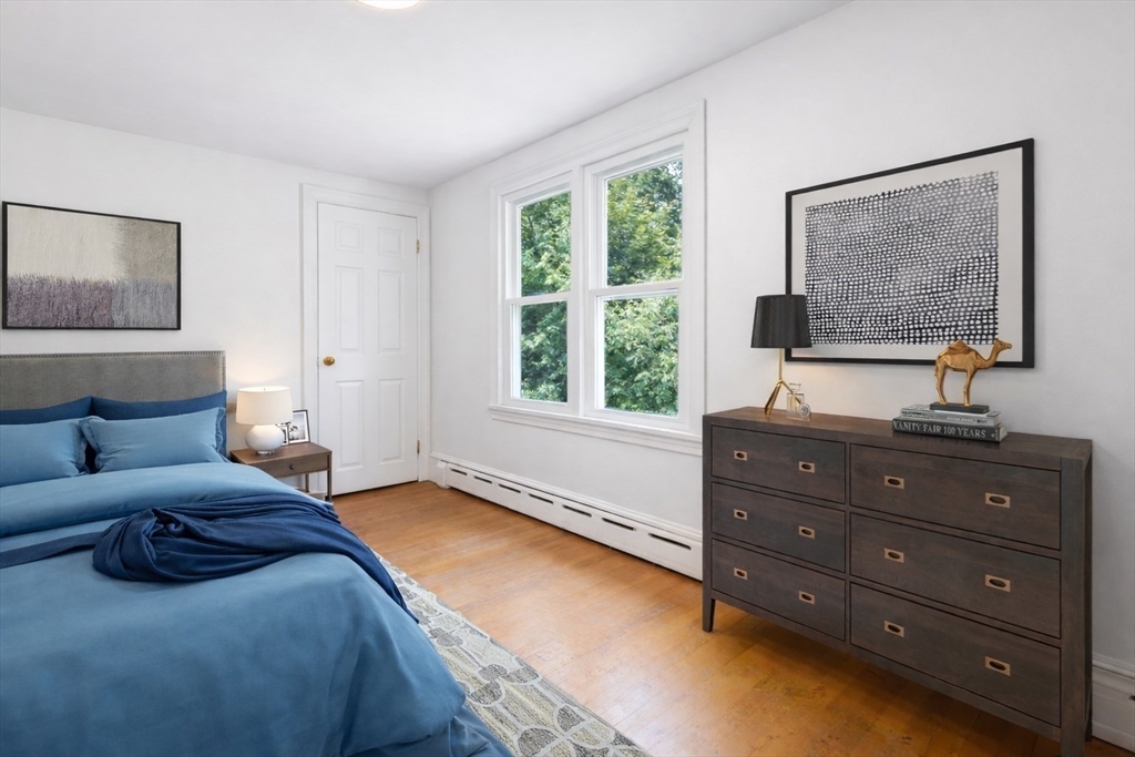 29 Boulevard Road Dedham, MA 02026 - Photo 22 of 34 a bedroom with a bed and a window