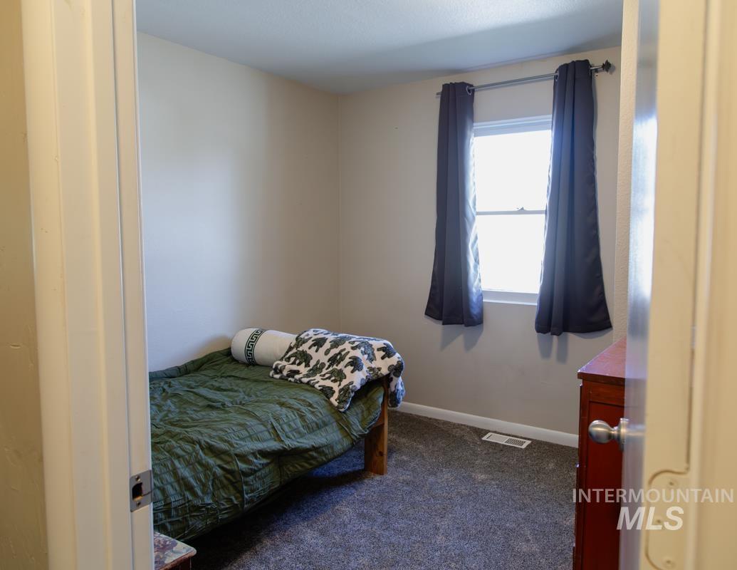 1404 Rochester Street Caldwell, ID 83605 - Photo 14 of 29 Neutral-toned walls complement the gray carpeting in this room