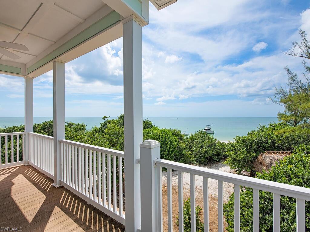 11231 Keewaydin Island Naples, FL 34113 - Photo 14 of 27 a view of a balcony with couches