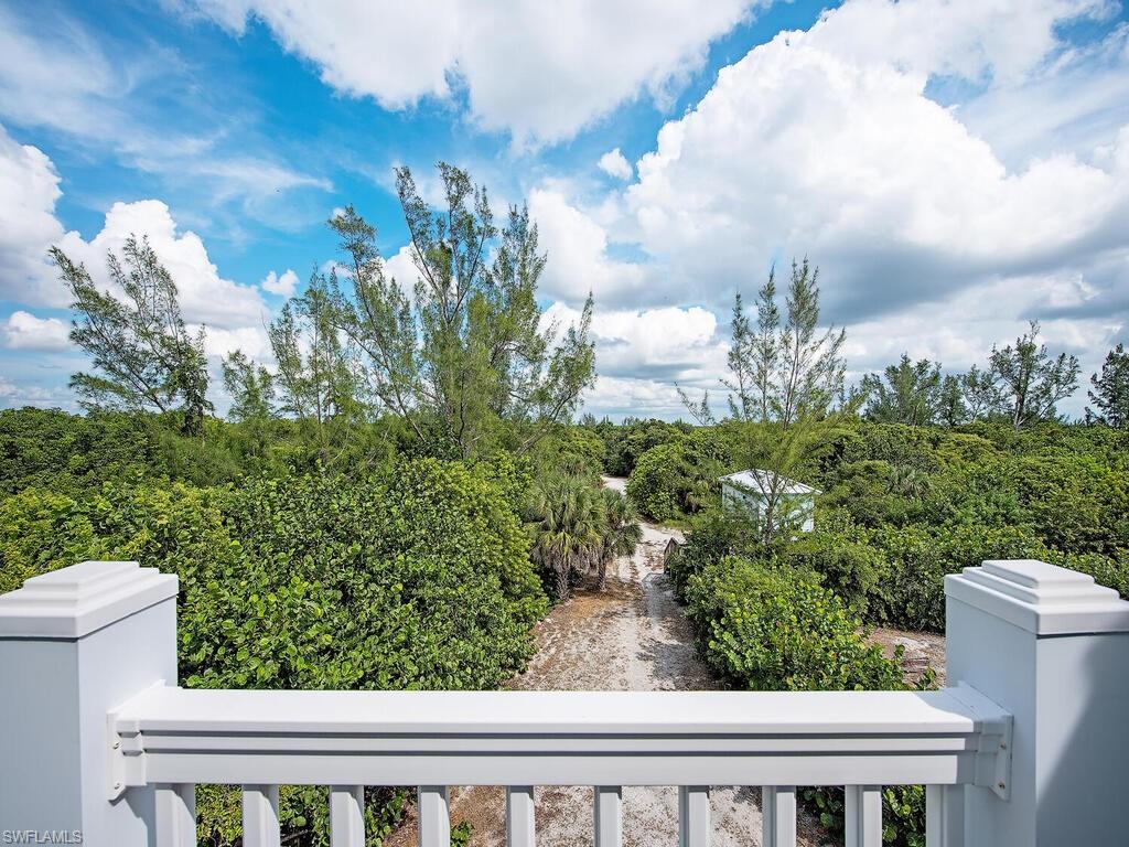 11231 Keewaydin Island Naples, FL 34113 - Photo 15 of 27 a view of a yard in front of house with wooden fence