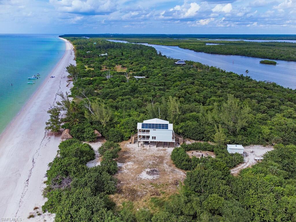 11231 Keewaydin Island Naples, FL 34113 - Photo 22 of 27 an aerial view of a houses with a yard