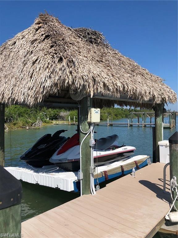 11231 Keewaydin Island Naples, FL 34113 - Photo 25 of 27 a view of outdoor space yard and patio