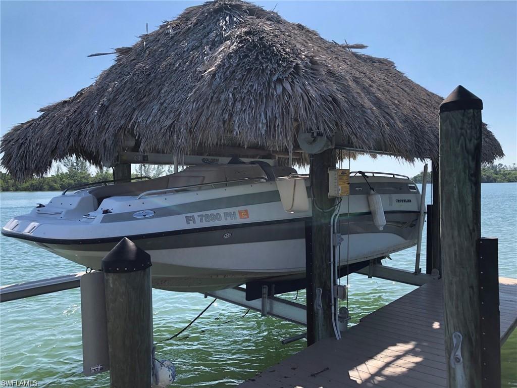 11231 Keewaydin Island Naples, FL 34113 - Photo 26 of 27 a view of a chairs and table in the balcony