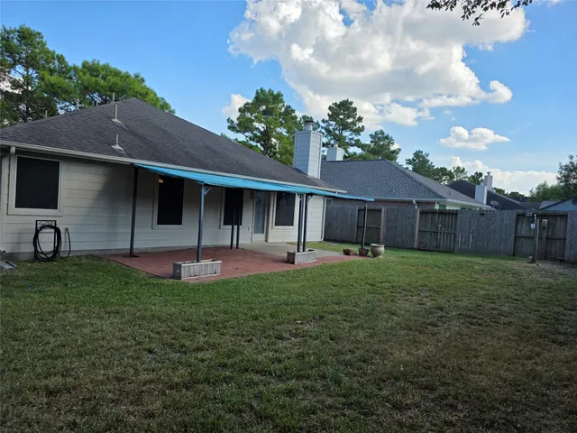 a front view of a house with a garden and plants