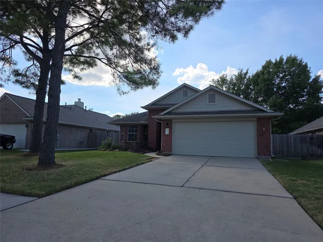 a house that has a tree in front of it