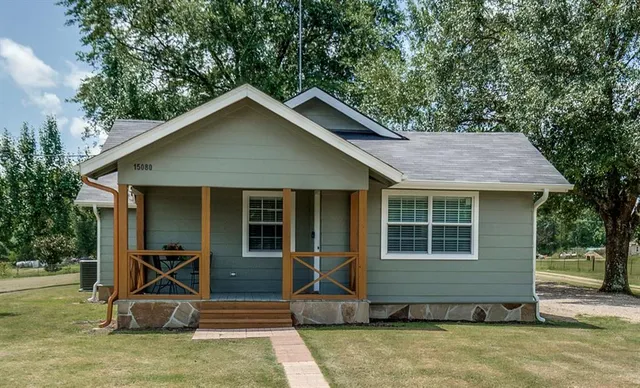 a view of a room with wooden floor and outdoor view