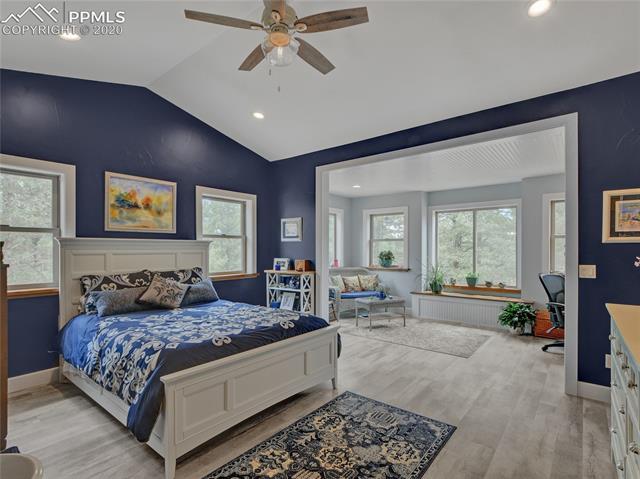 652 Ridge Road Divide, CO 80814 - Photo 2 of 20 Vaulted ceilings, Shaw luxury vinyl plank flooring and abundant windows lend a dramatic flair to the spacious master suite.