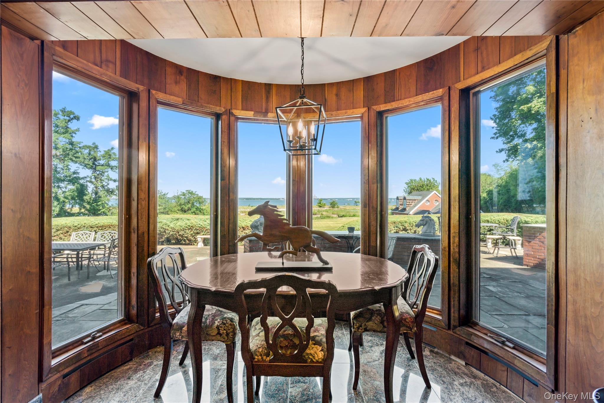 22 Messenger Lane Sands Point, NY 11050 - Photo 16 of 49 a view of a dining room with furniture window and outside view