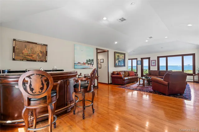 a living room with furniture ceiling fan and a window