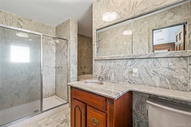 a view of a bedroom with furniture and floor to ceiling window