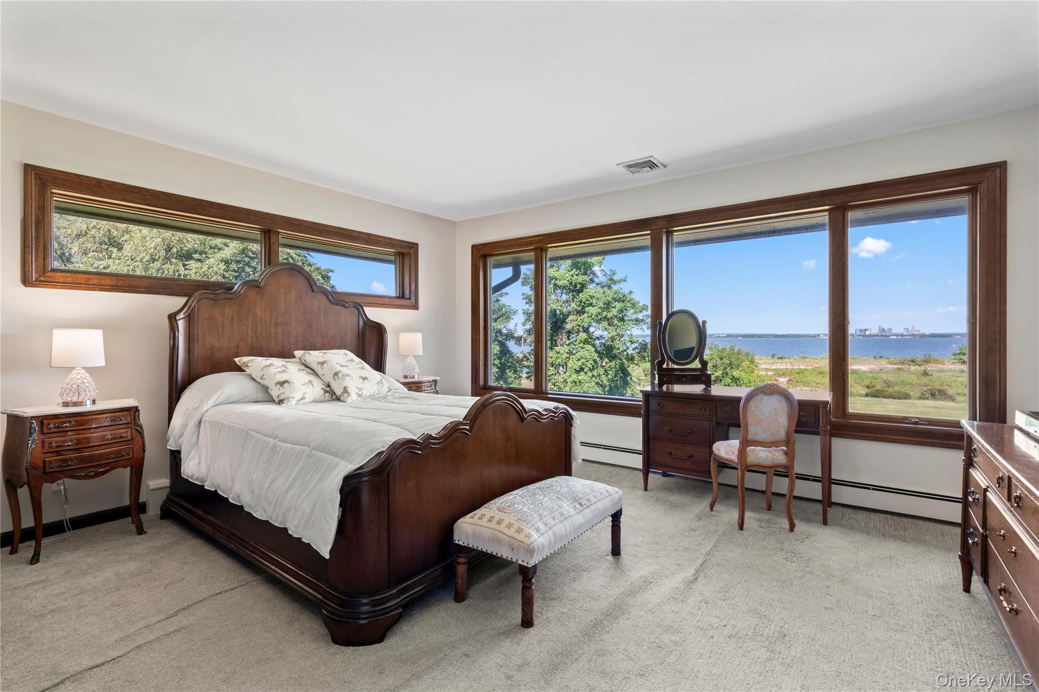 22 Messenger Lane Sands Point, NY 11050 - Photo 30 of 49 a bedroom with a bed and a couch