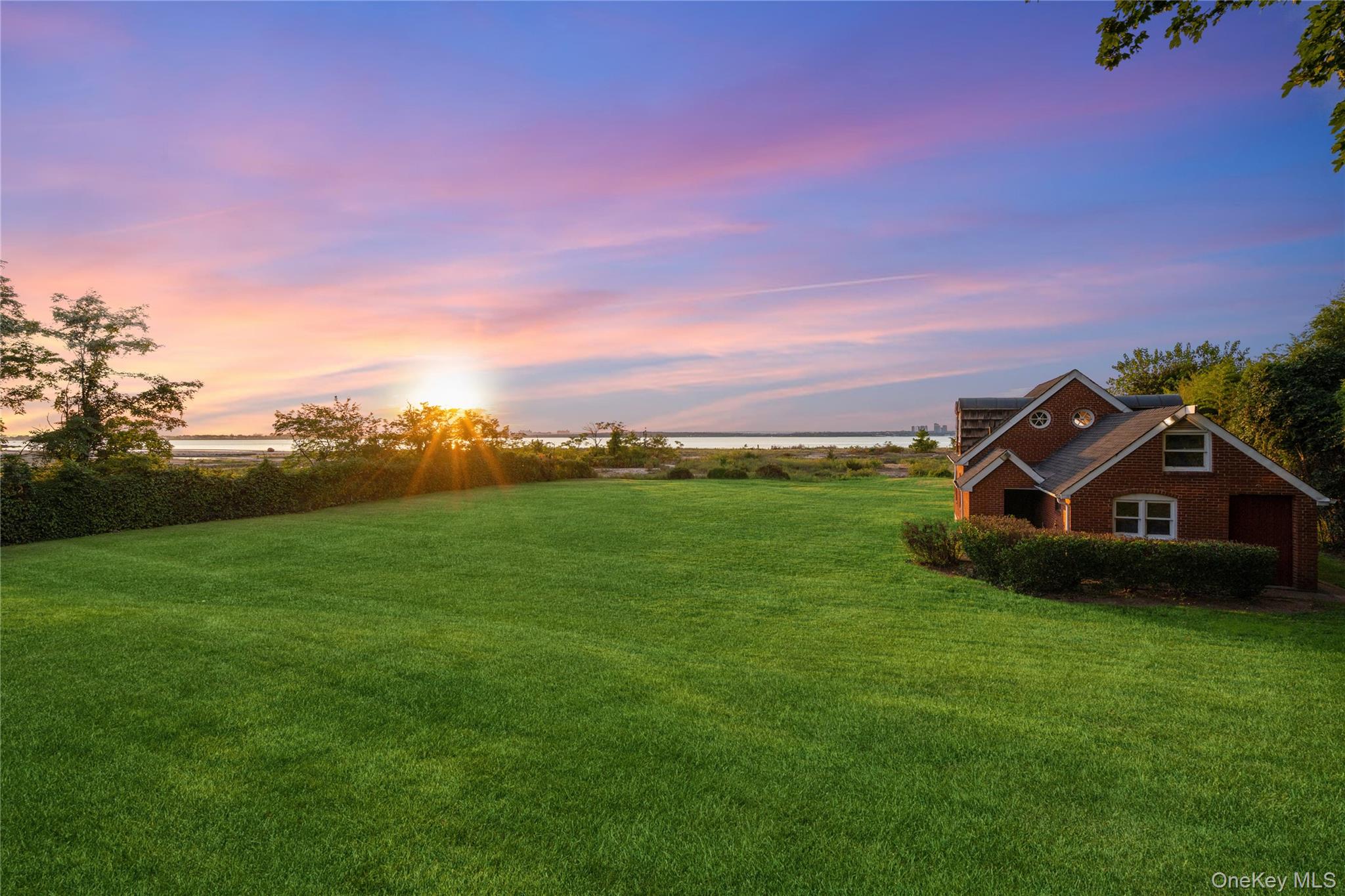 22 Messenger Lane Sands Point, NY 11050 - Photo 3 of 11 a view of a green field in front of the house