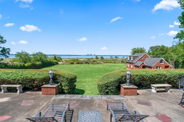 a view of a chairs and table in the patio