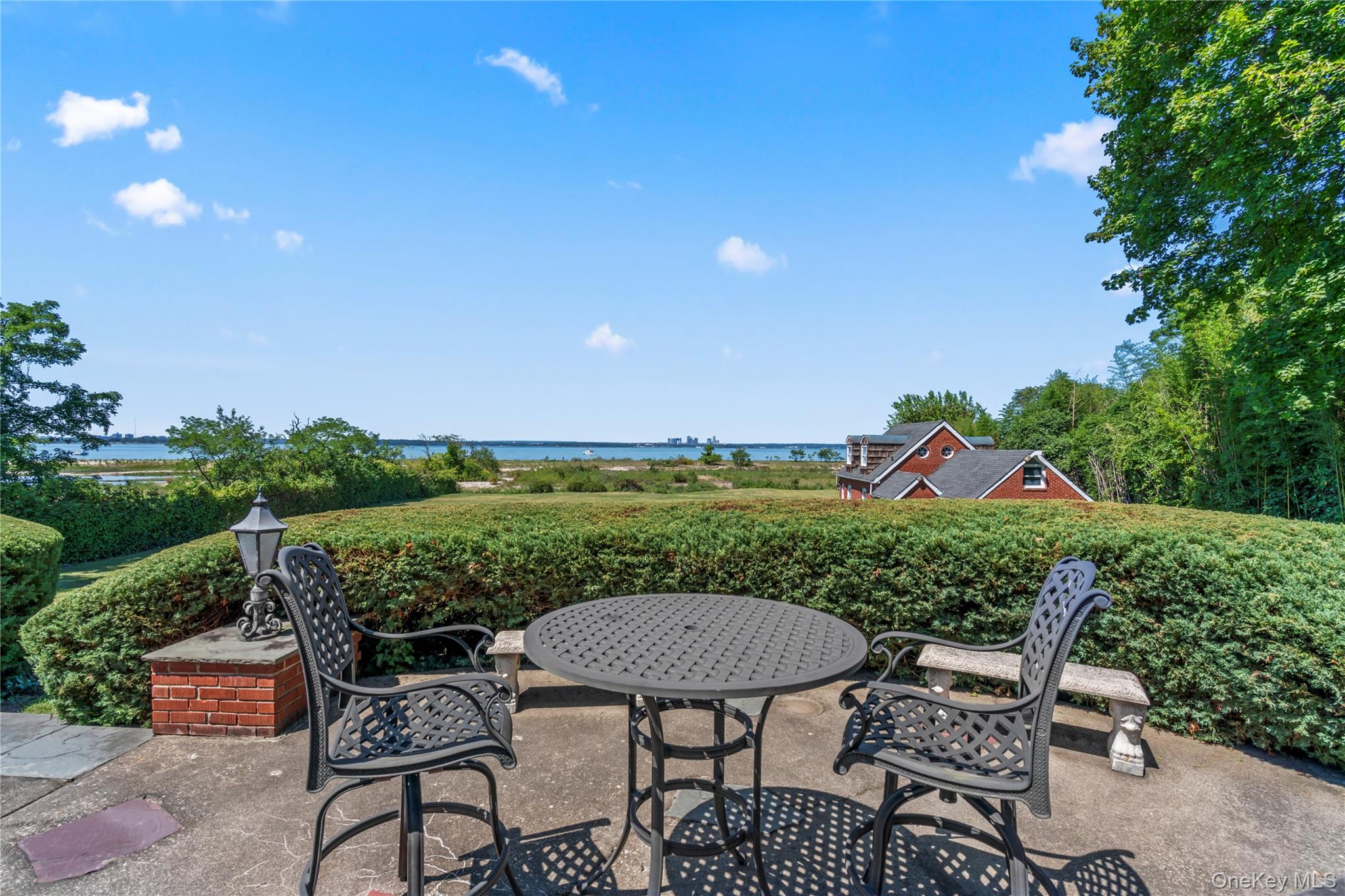 22 Messenger Lane Sands Point, NY 11050 - Photo 33 of 49 a view of a chairs and table in the patio