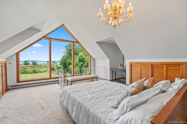 a room with a clock and a view of kitchen
