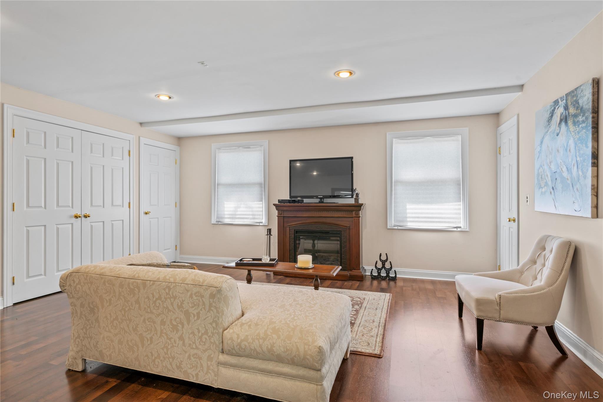 22 Messenger Lane Sands Point, NY 11050 - Photo 38 of 49 a living room with furniture and a fireplace