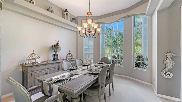 a large kitchen with granite countertop lots of counter space and window
