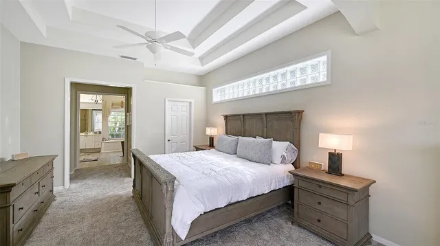 a bathroom with a sink a toilet a mirror and shower curtain