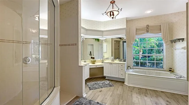 a bedroom with a bed and a tv on the dresser