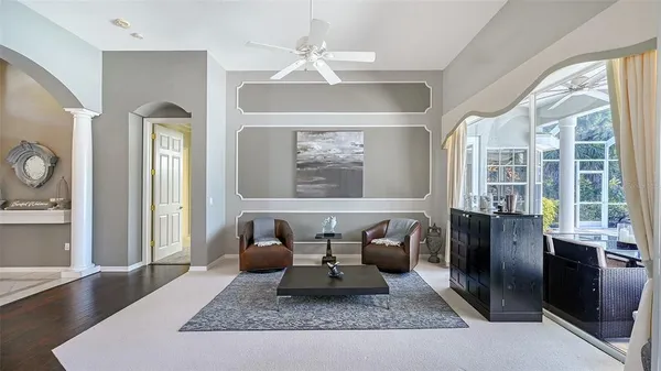 a view of a dining room with furniture wooden floor and chandelier