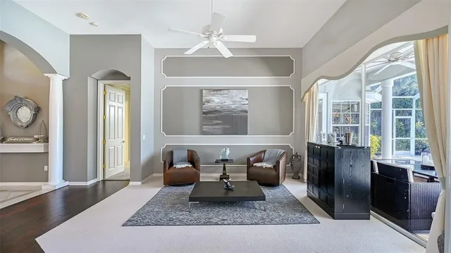 a view of a dining room with furniture wooden floor and chandelier
