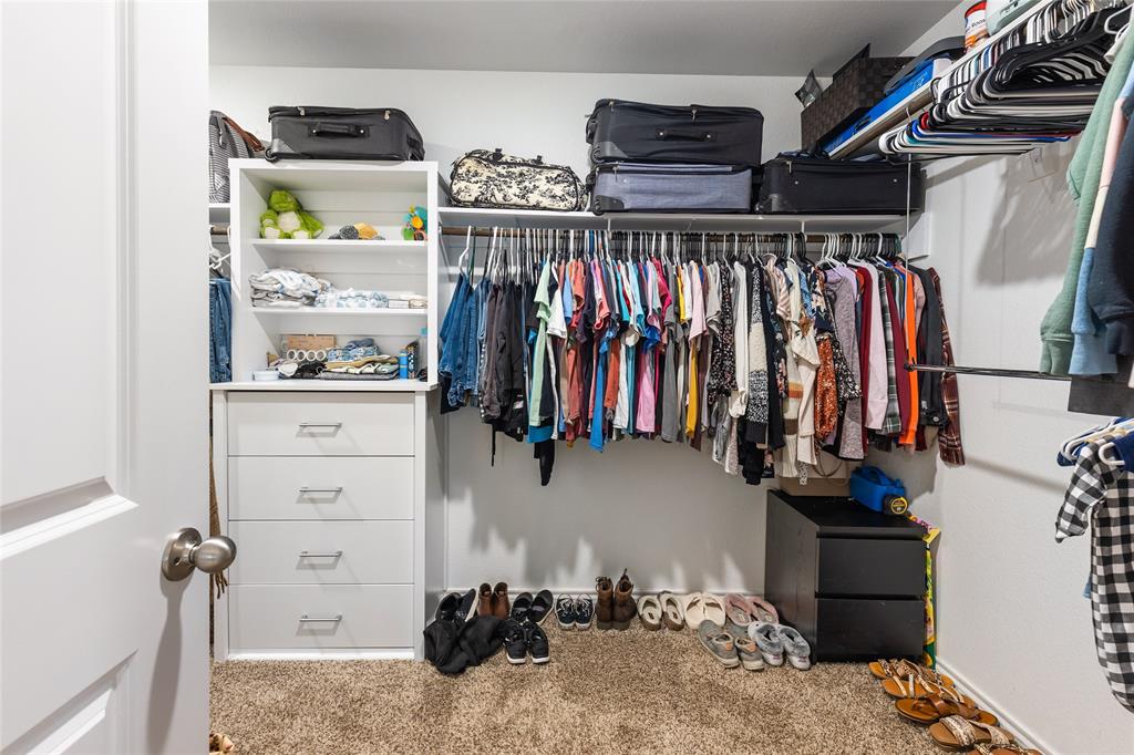 173 Seabiscuit Road Caddo Mills, TX 75135 - Photo 19 of 40 a view of walk in closet with clothes and shoes