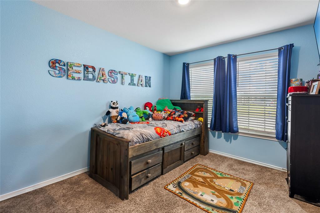 173 Seabiscuit Road Caddo Mills, TX 75135 - Photo 20 of 40 a bed room with a bed and a window