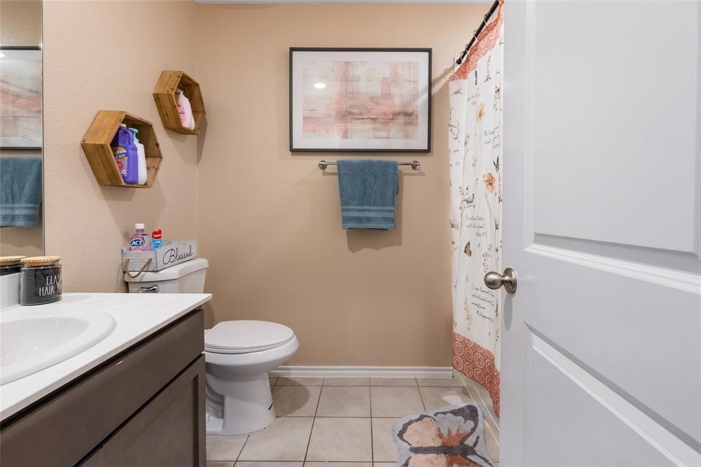 173 Seabiscuit Road Caddo Mills, TX 75135 - Photo 23 of 40 a bathroom with a sink toilet and shower