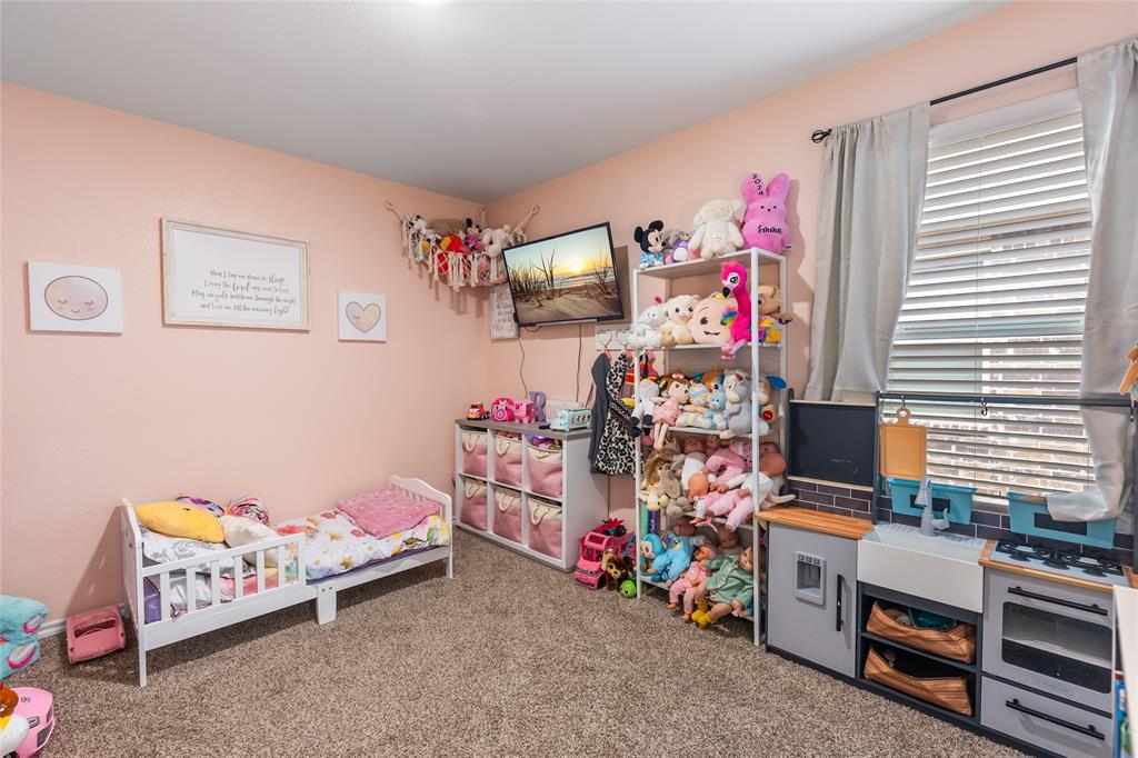 173 Seabiscuit Road Caddo Mills, TX 75135 - Photo 24 of 40 a room with toys and storage
