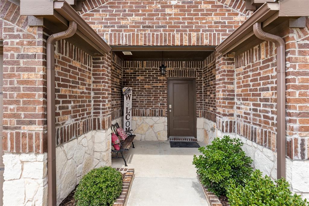 173 Seabiscuit Road Caddo Mills, TX 75135 - Photo 4 of 40 a front view of a house with a garden