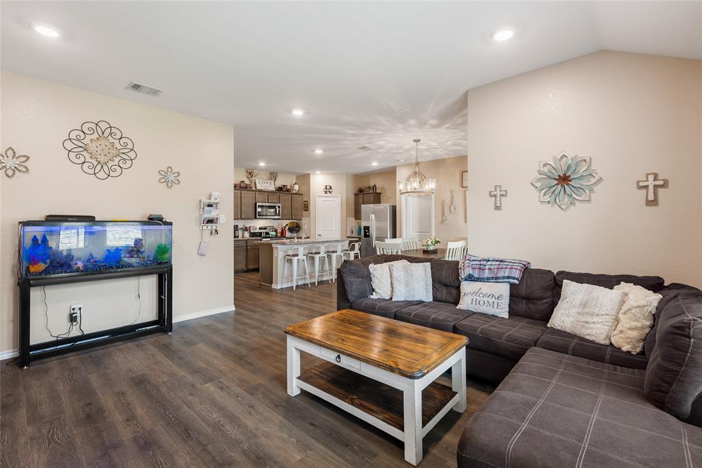 173 Seabiscuit Road Caddo Mills, TX 75135 - Photo 8 of 40 a living room with furniture and a flat screen tv