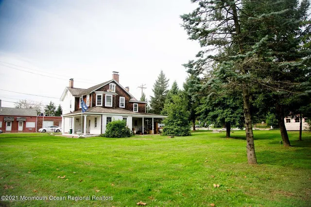 a front view of a house with a yard table and chairs