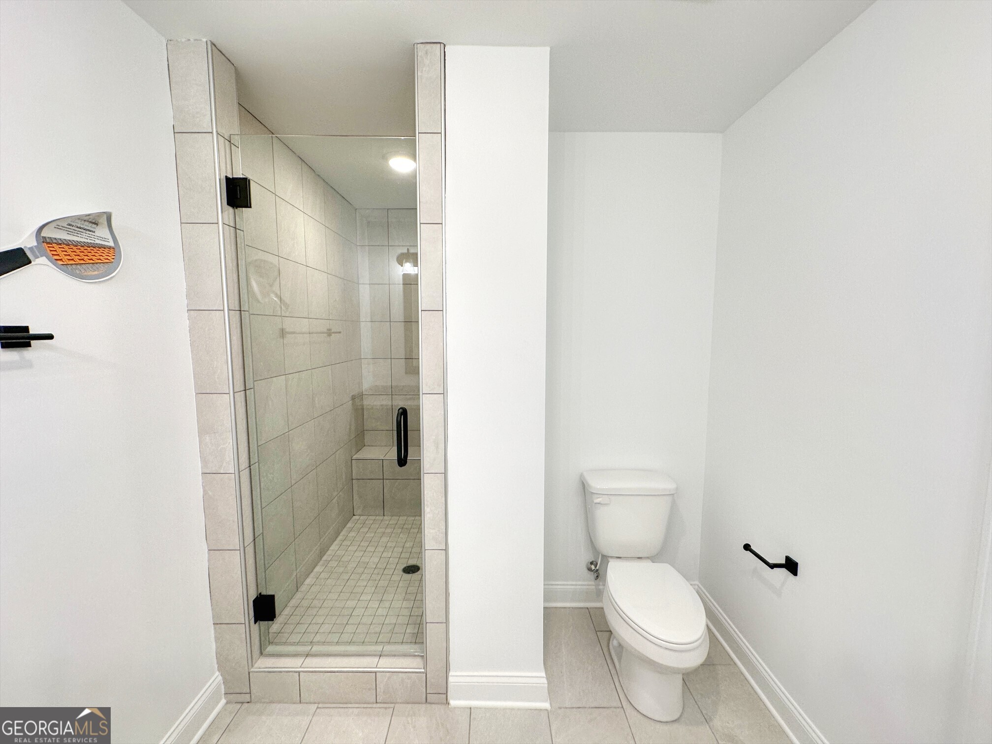 11 River's Edge Lane Franklin, GA 30217 - Photo 11 of 25 a bathroom with a toilet and a shower