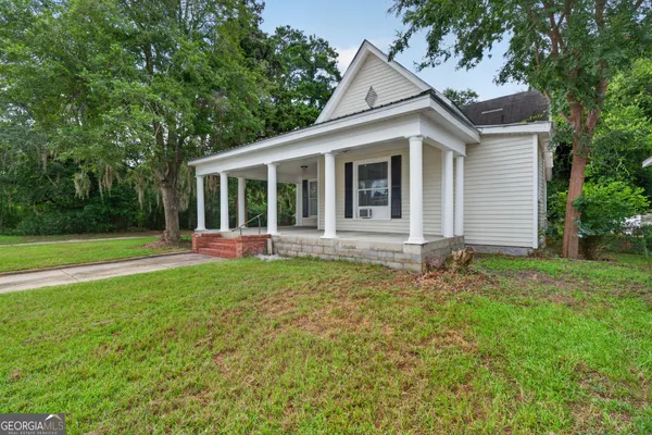 front view of a house with a yard