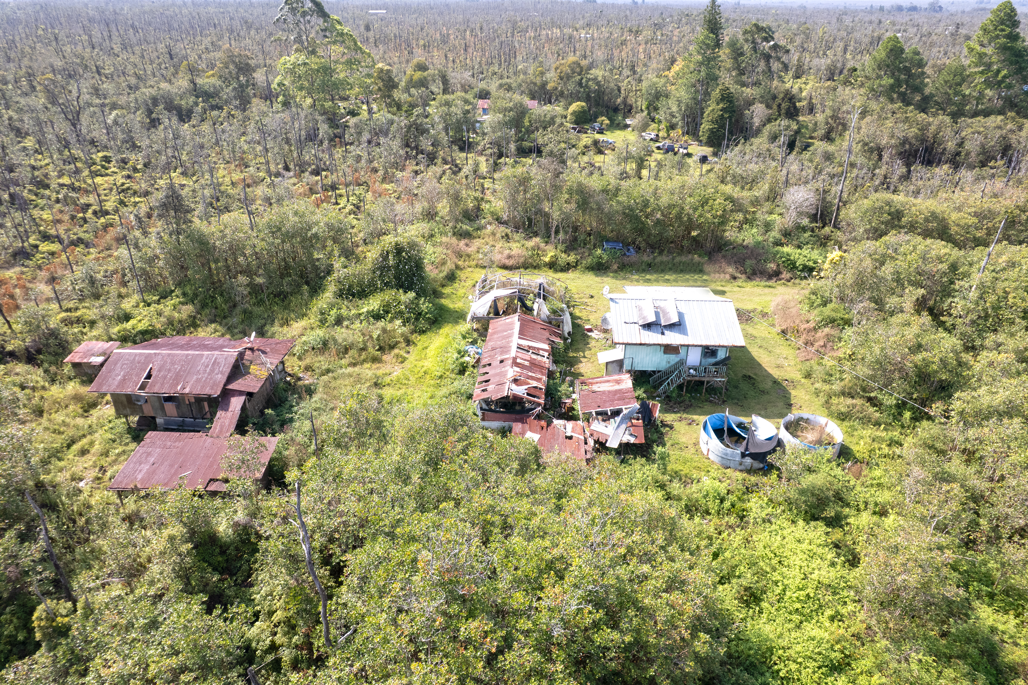11-2217 Kaleponi Road Mountain View, HI 96771 - Photo 6 of 13 an aerial view of a house with a yard