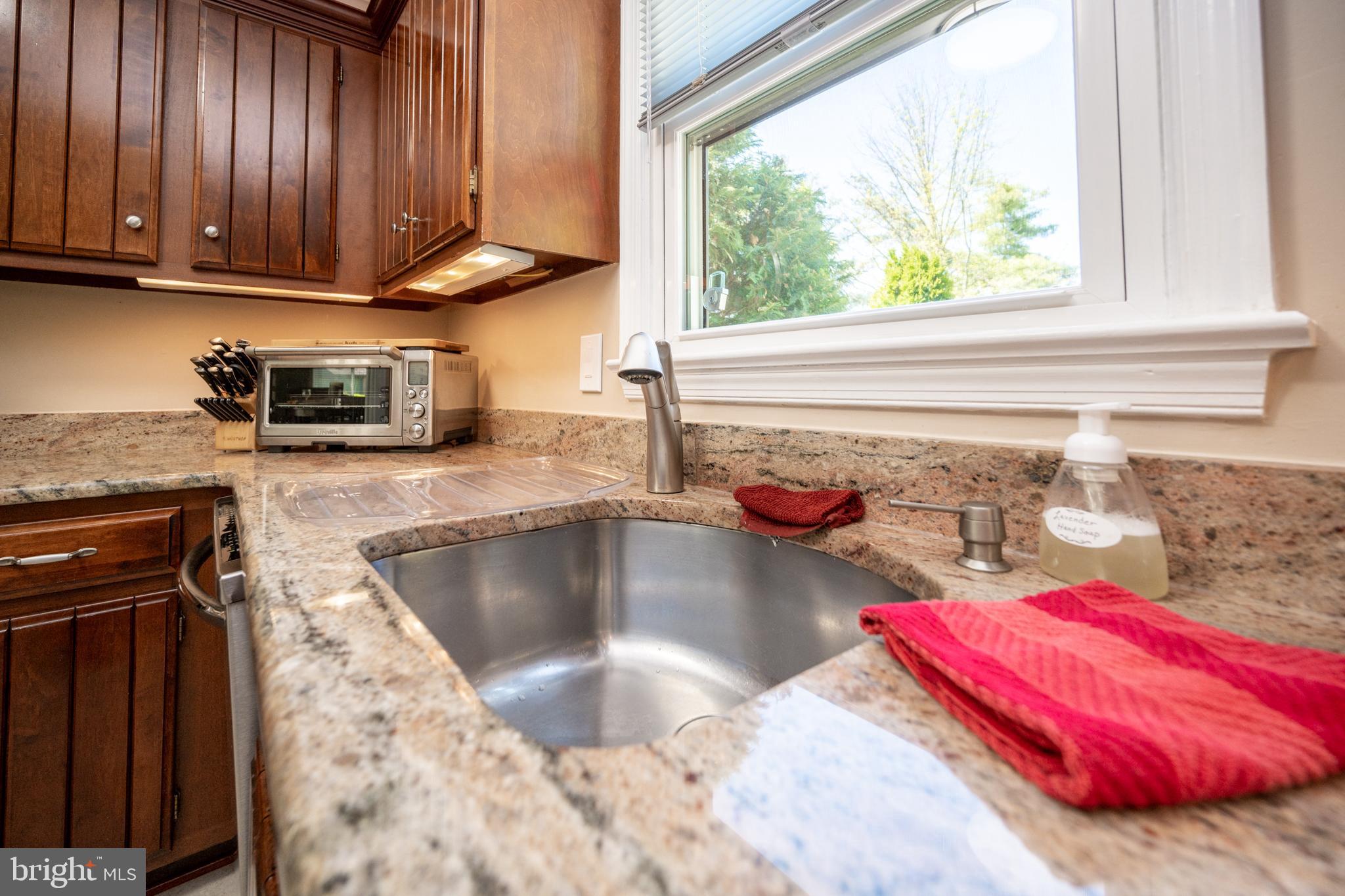 12421 Wendell Holmes Road Oak Hill, VA 20171 - Photo 25 of 56 Kitchen countertop showing sink and window
