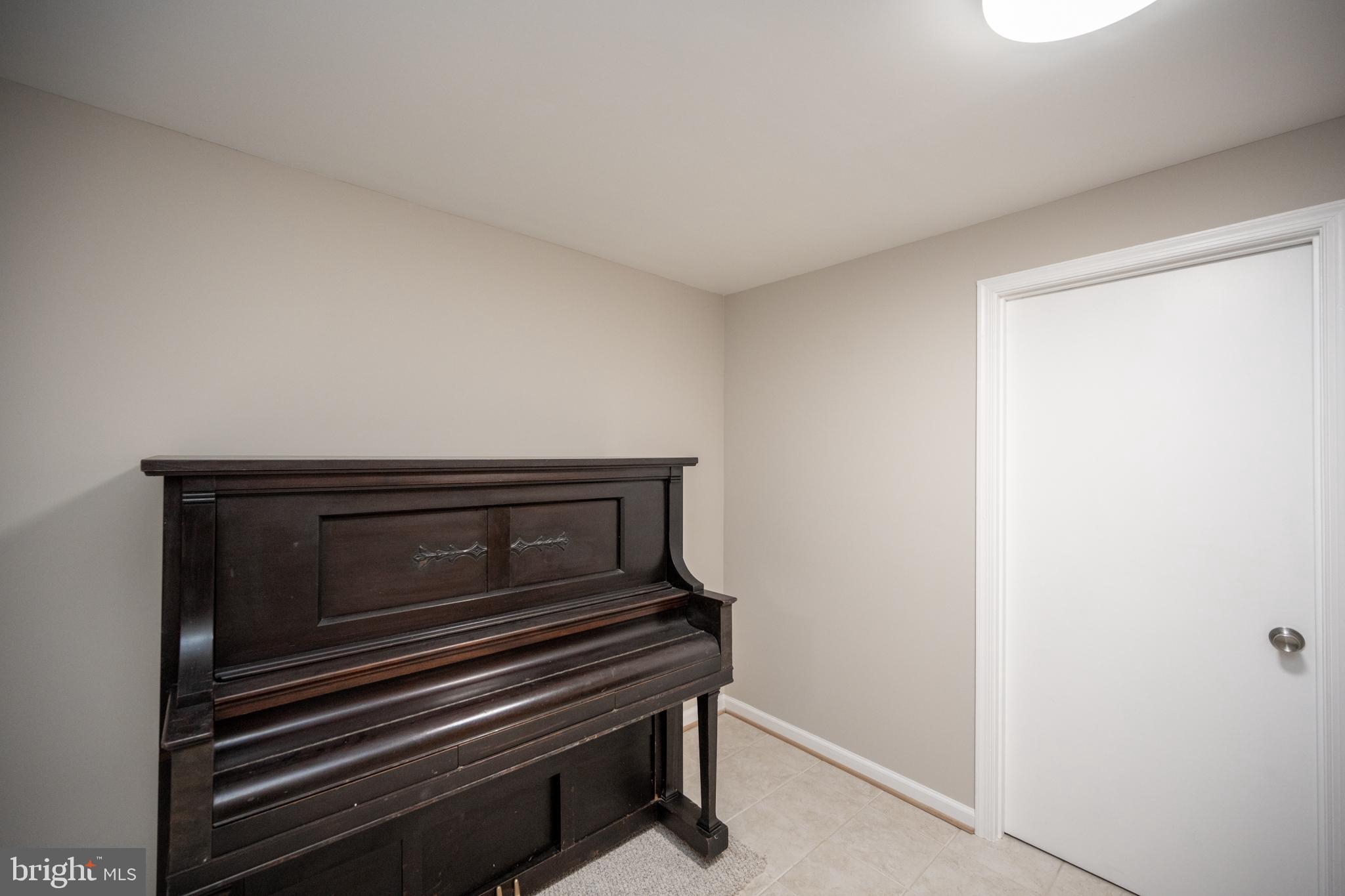 12421 Wendell Holmes Road Oak Hill, VA 20171 - Photo 48 of 56 Antique piano in lower level which "conveys"!