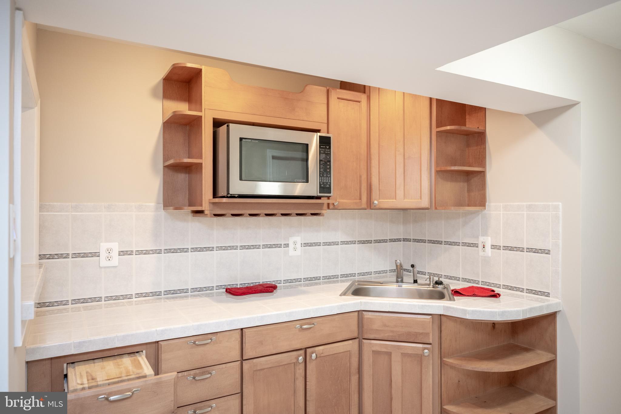 12421 Wendell Holmes Road Oak Hill, VA 20171 - Photo 50 of 56 Bar area with wet sink and microwave shlef