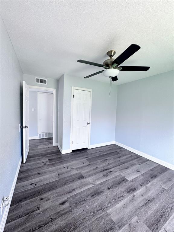 345 16th Street Southwest Paris, TX 75460 - Photo 11 of 15 a view of an empty room with wooden floor