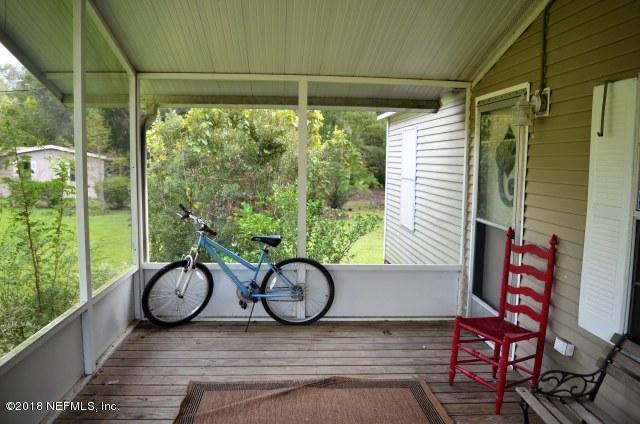 54170 Vontz Road East Callahan, FL 32011 - Photo 16 of 24 a couple of bicycles parked next to a window