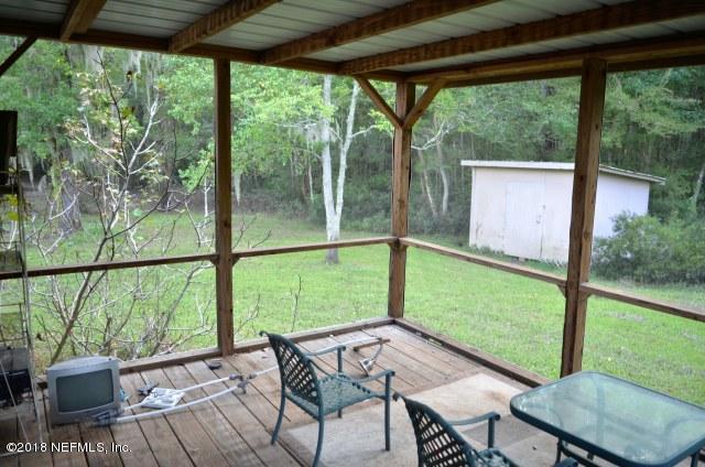 54170 Vontz Road East Callahan, FL 32011 - Photo 18 of 24 a view of a yard with furniture and garden