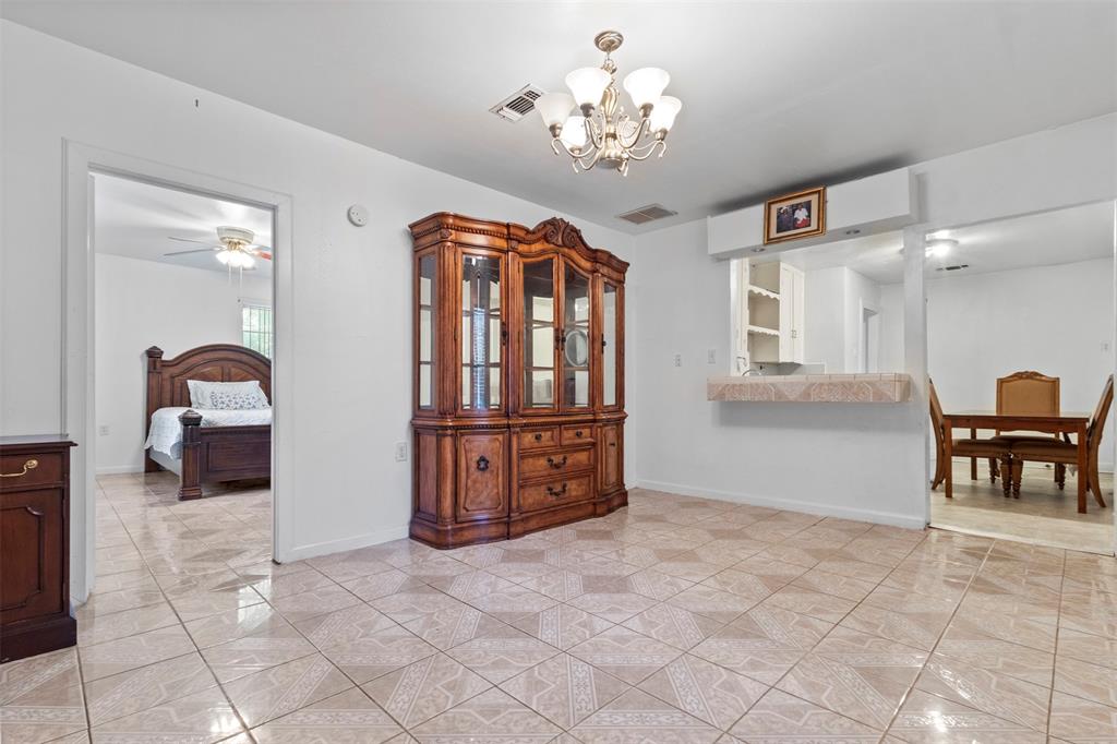 2821 Burchill Road South Fort Worth, TX 76105 - Photo 11 of 33 Dining space featuring a chandelier and a ceiling fan