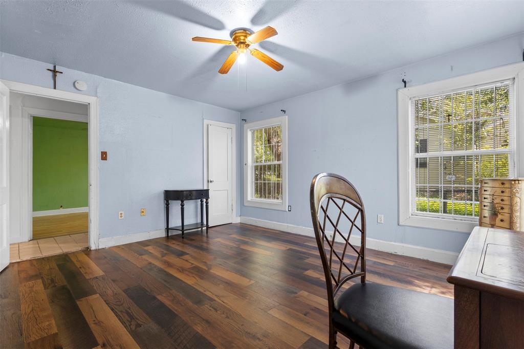 2821 Burchill Road South Fort Worth, TX 76105 - Photo 16 of 33 Unfurnished office featuring wood finished floors, a ceiling fan, and a textured ceiling