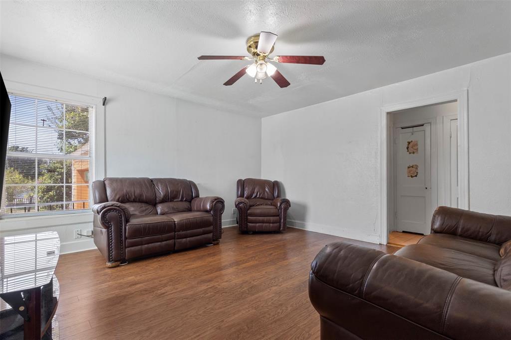 2821 Burchill Road South Fort Worth, TX 76105 - Photo 5 of 33 Living room with wood finished floors, a textured ceiling, and a ceiling fan