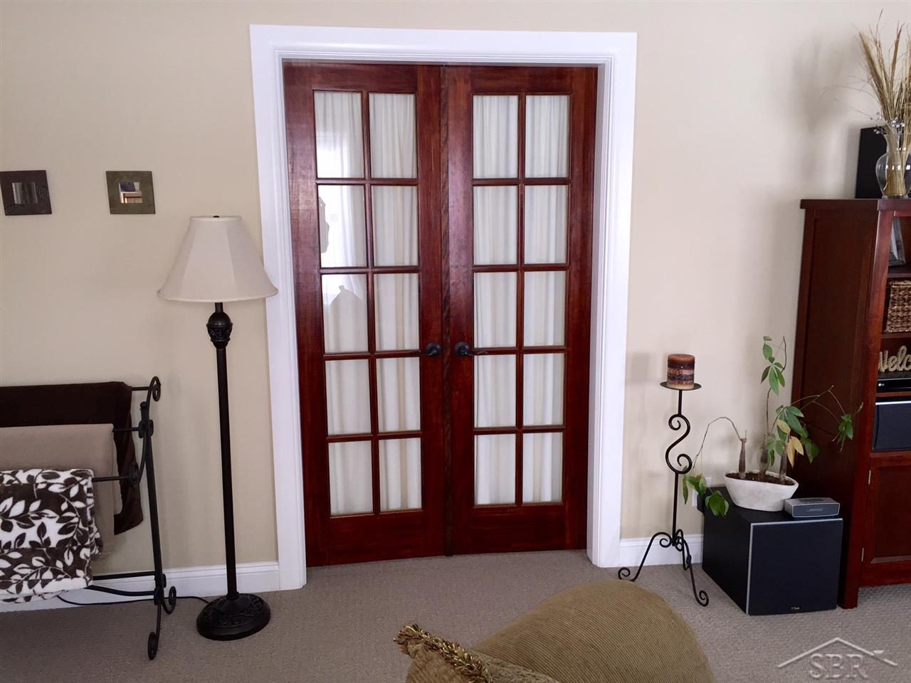 14670 Gratiot Road Hemlock, MI 48626 - Photo 6 of 35 French doors in the living room lead to the marvelous master suite!