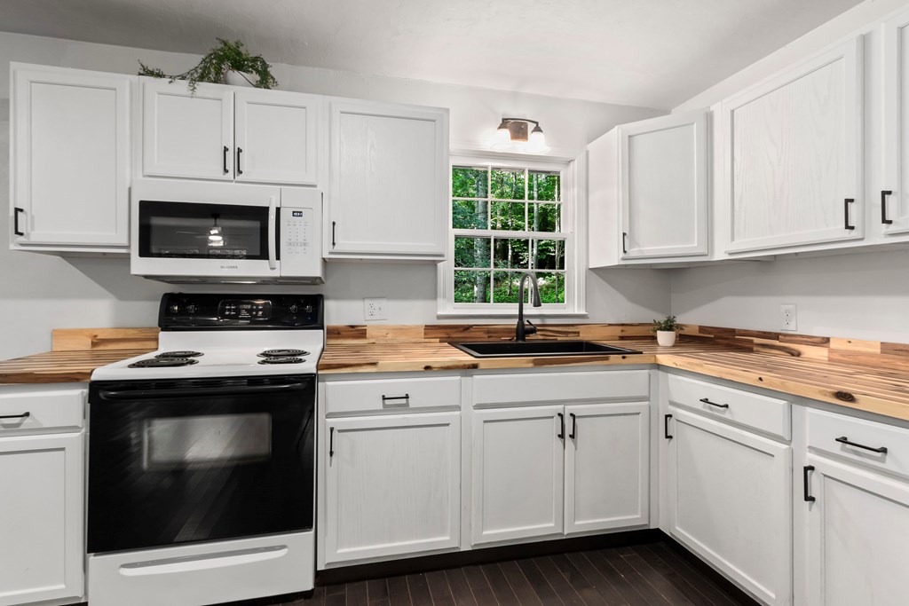 123 Quarry Road Andrews, NC 28901 - Photo 13 of 51 a kitchen with cabinets stainless steel appliances a sink and a window
