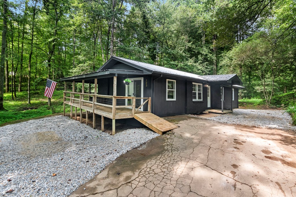 123 Quarry Road Andrews, NC 28901 - Photo 2 of 51 a wooden bench sitting in front of a house